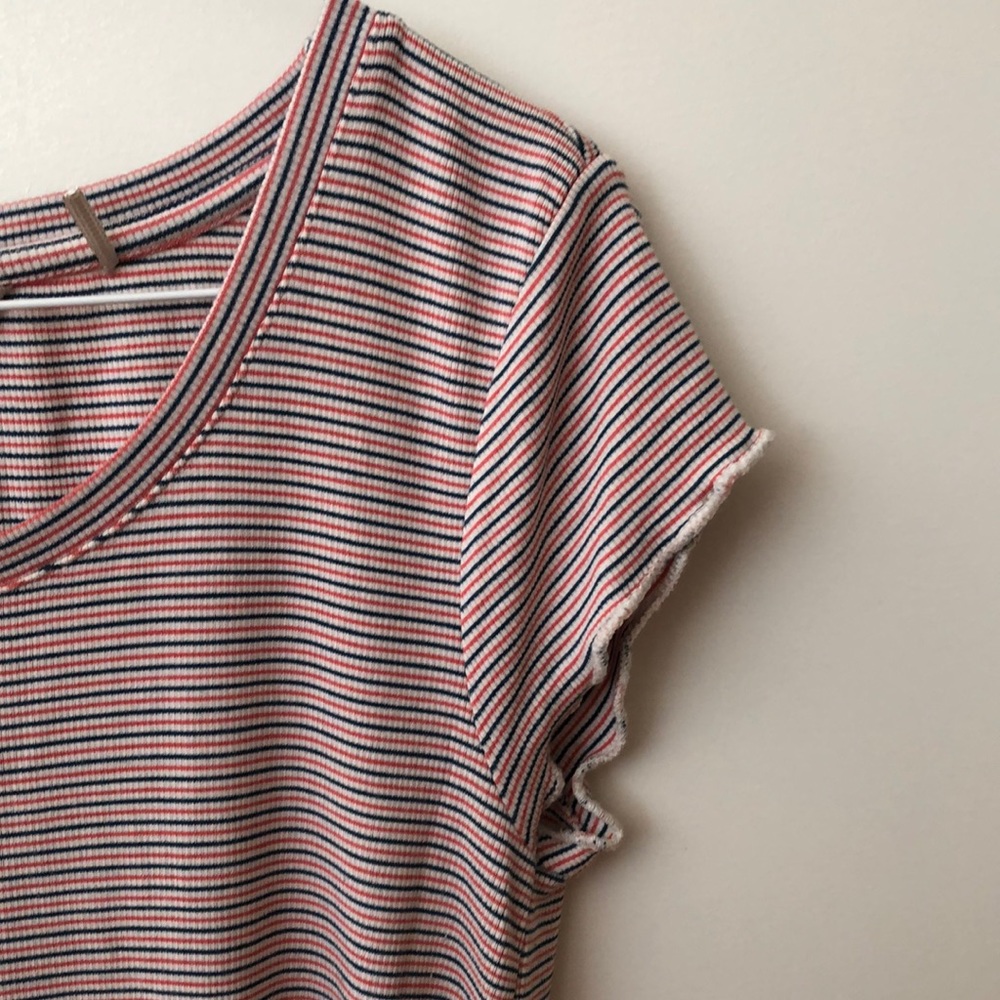 S/M tshirt. Good fabric. Super soft. Good quality brand sold at MEC.